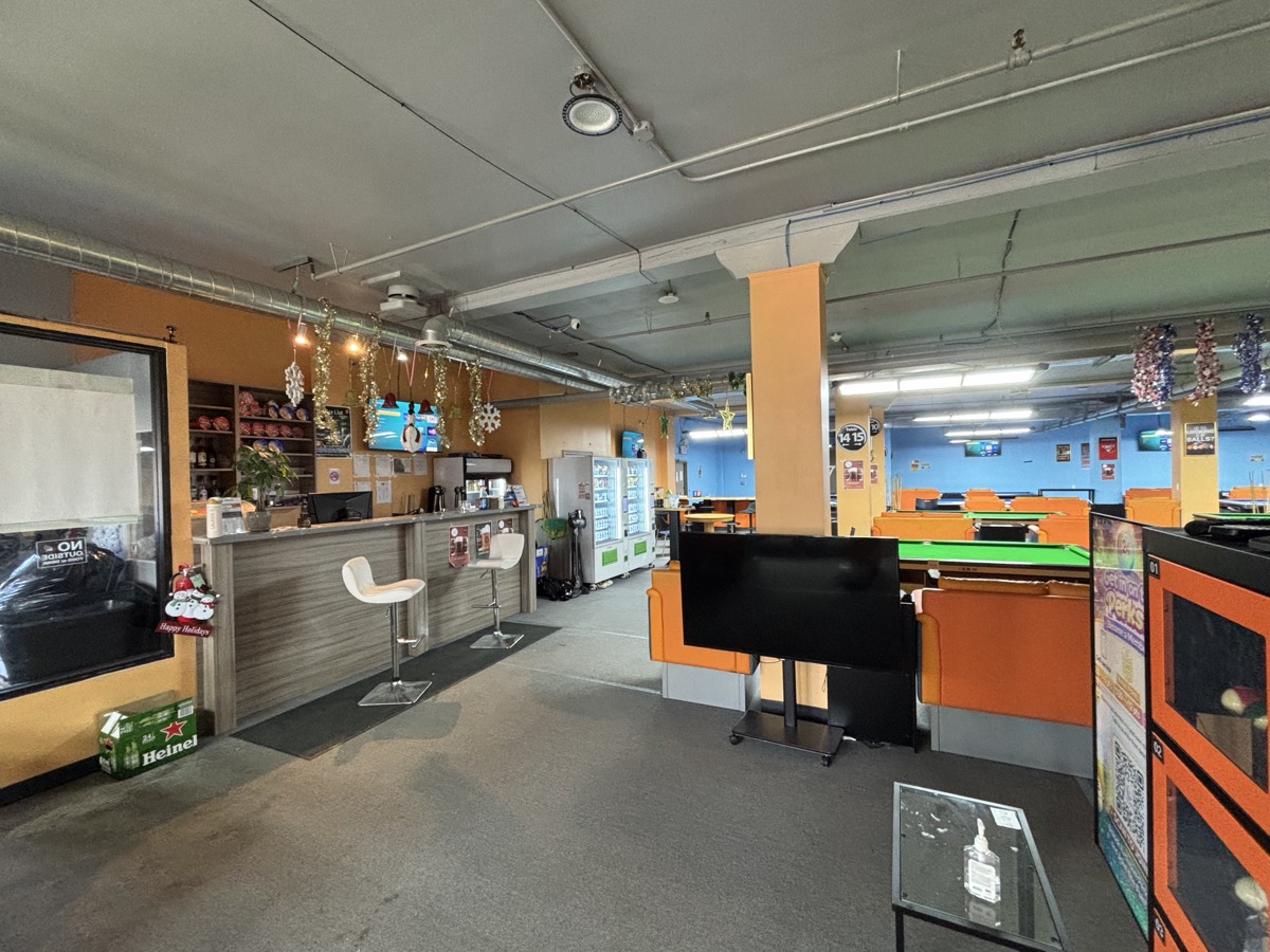 Service counter and bright table area at 24Billiards.